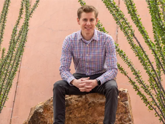 man sitting desert header image