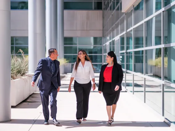 Three Executive MBA Students Walking Through McClelland Hall