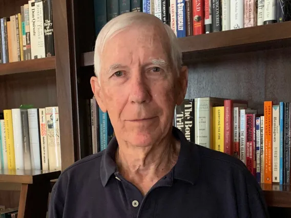 mark walker headshot in a library