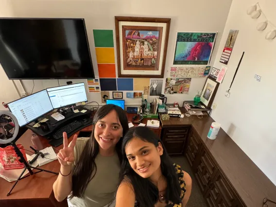 two girls smiling at the office