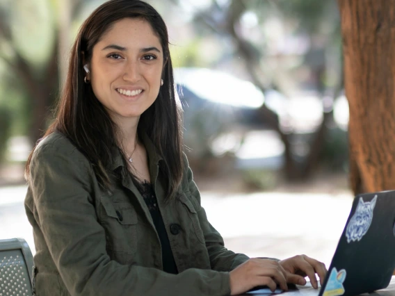 girl on laptop outside