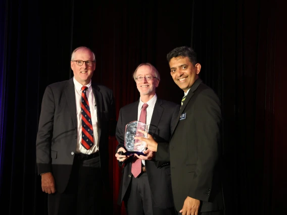 three men and an award
