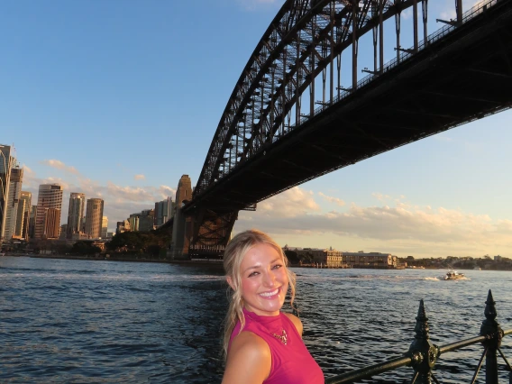 girl in front of bridge