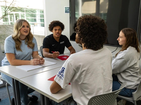 four students in study room