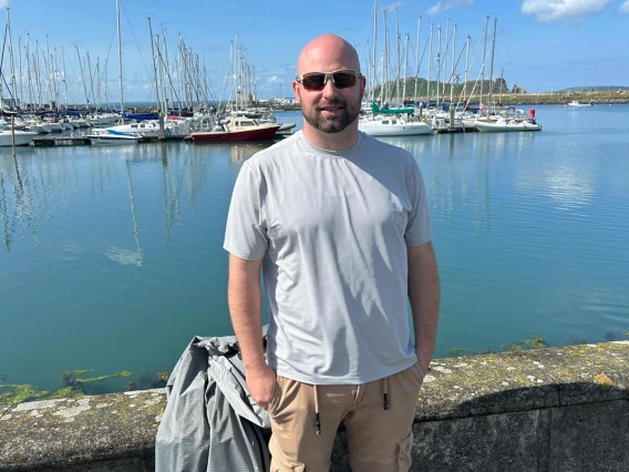 man standing in front of body of water