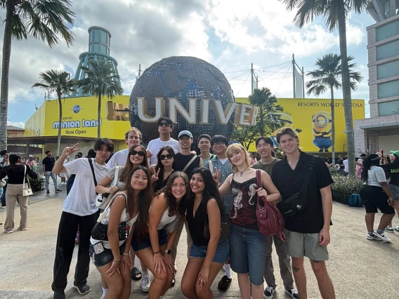 people standing in front of universal studios