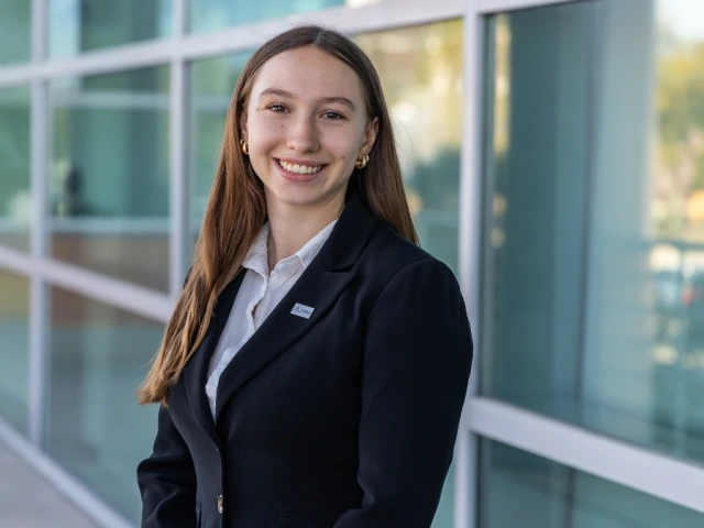 girl student in front of building