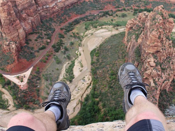 Man sitting above canyon