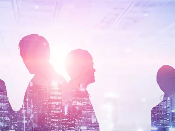 Business people meeting with cityscape superimposed