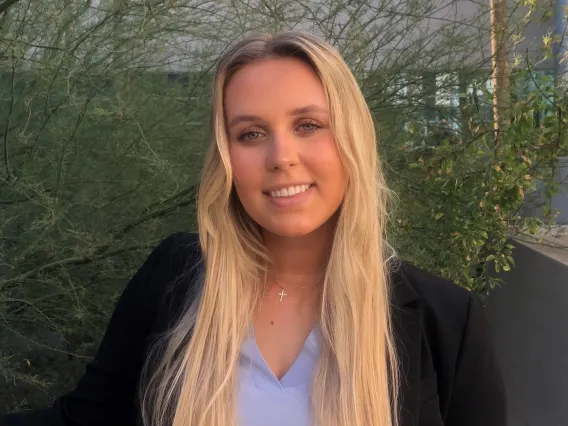 Blonde woman in a suit. 