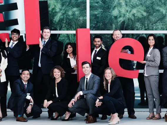 Eller MBA students with ELLER letters