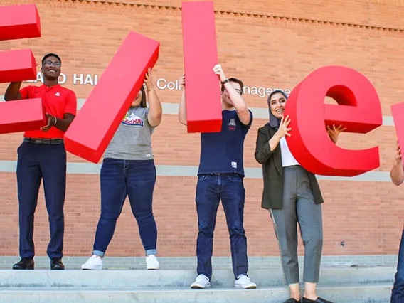 Eller College students with ELLER letters