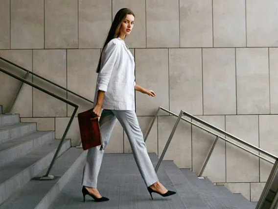 Professional woman walking down stairs