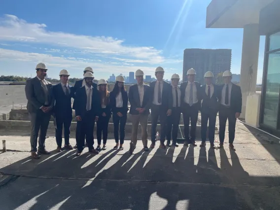 group photo outside in construction hats