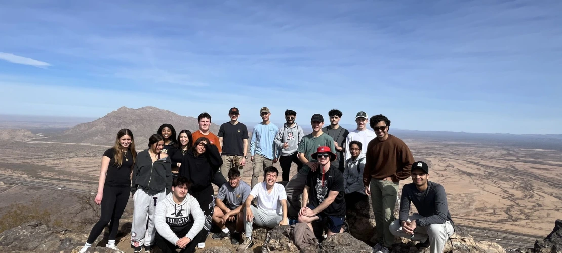 Students at the top of a mountain