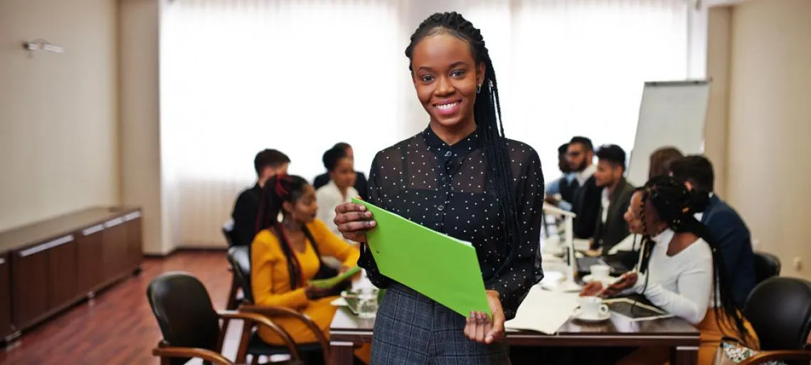 personal brand lady in business casual standing there