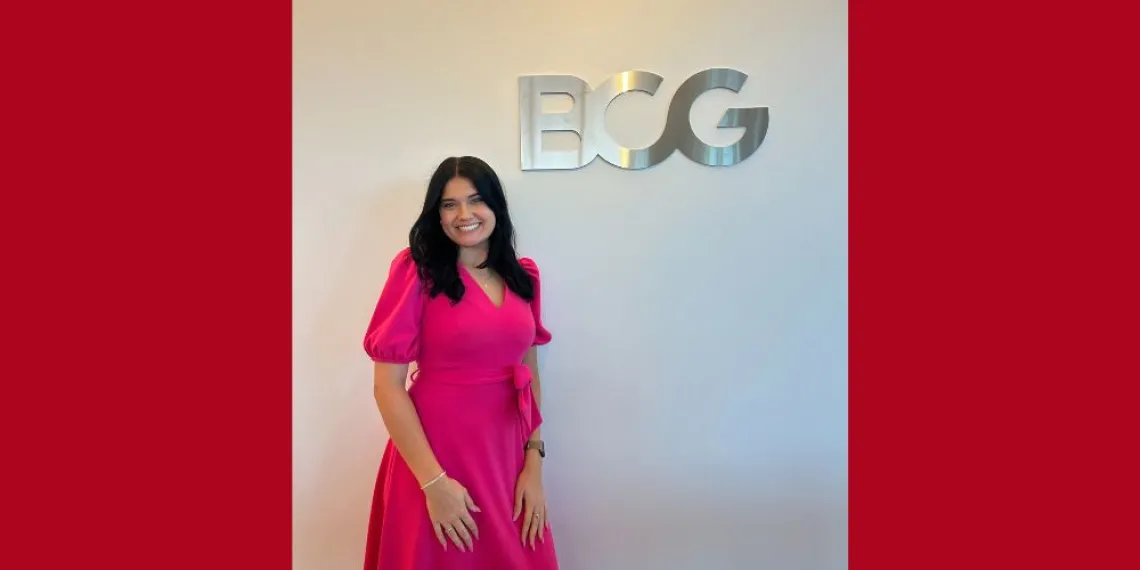 Woman with black hair smiling.