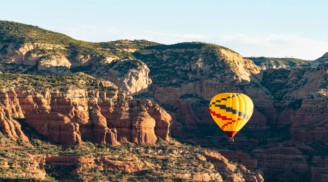 Hot air balloon over mountains