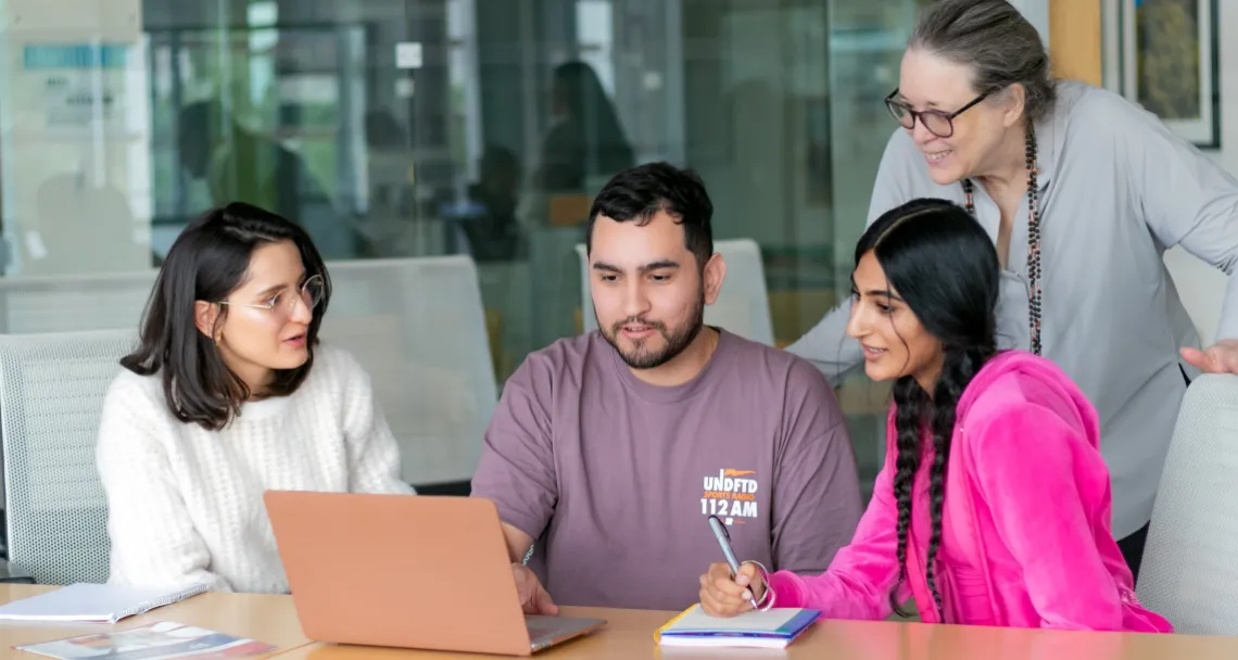 students looking at a computer