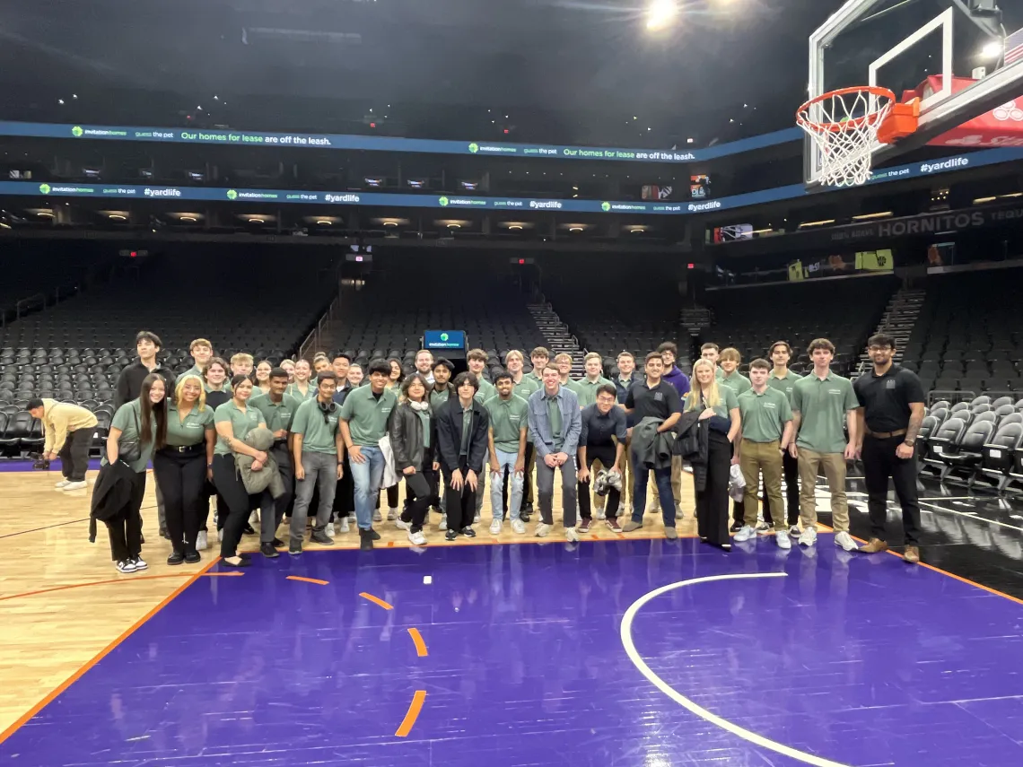 Students standing on a basketball court