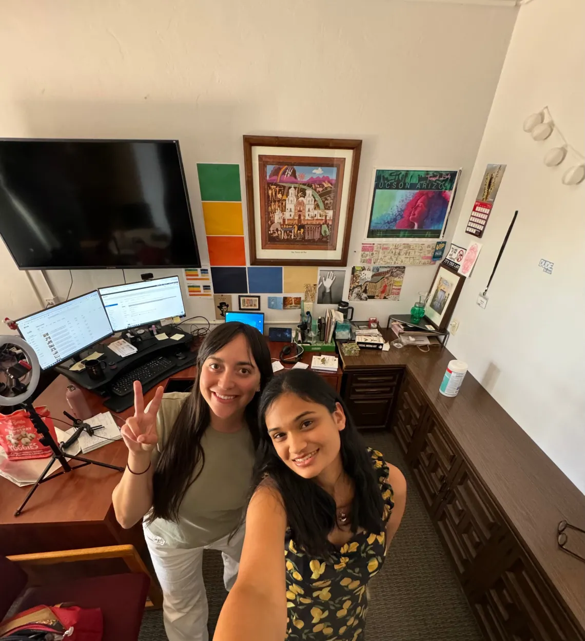 two girls smiling at the office