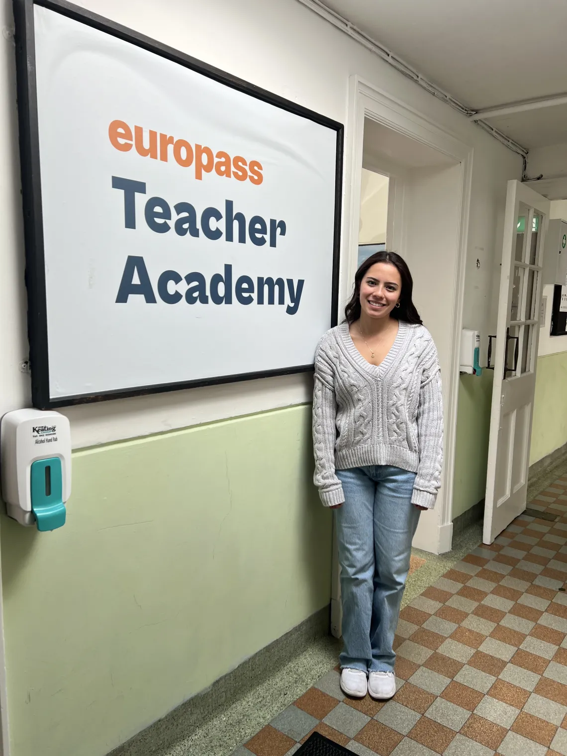 girl in front of logo