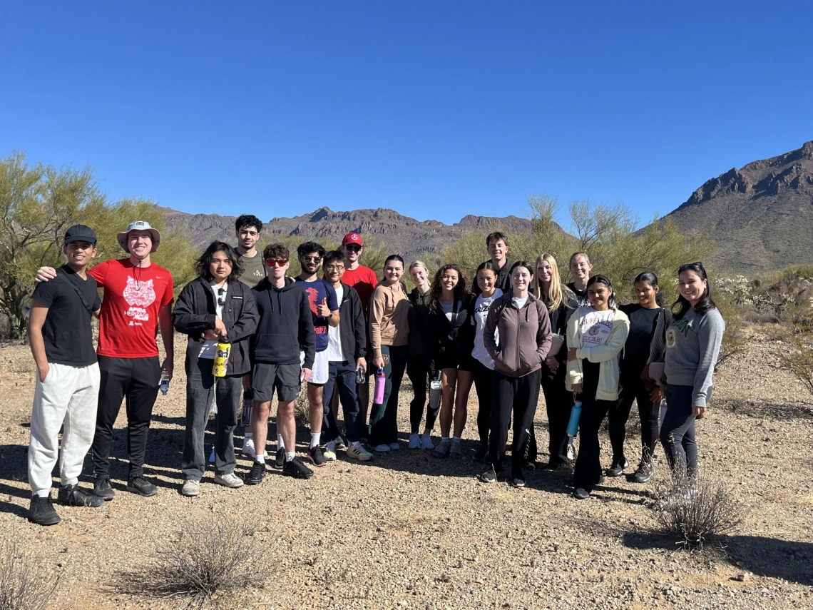 Students outside in the desert on a hike