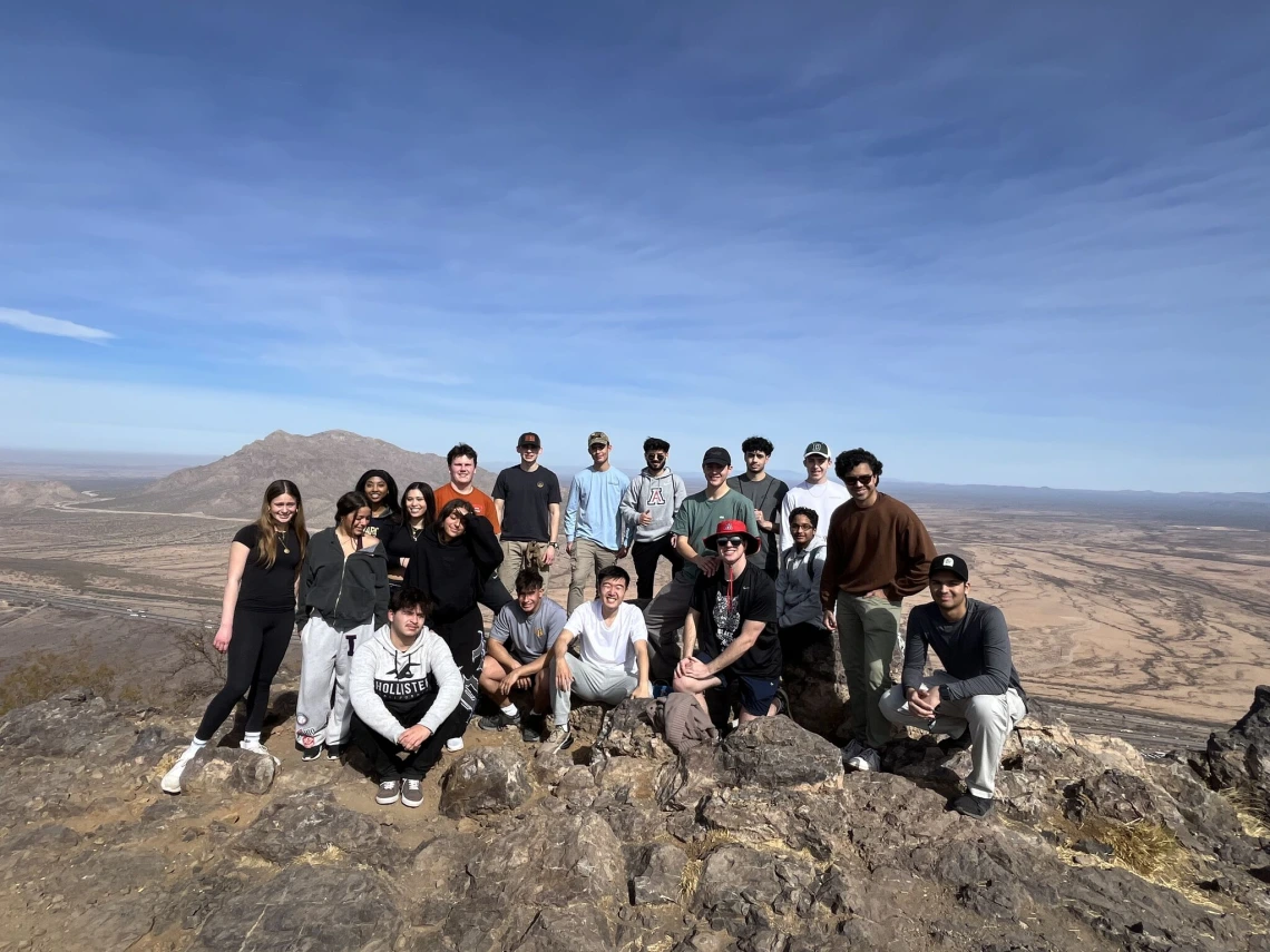 Students at the top of a mountain