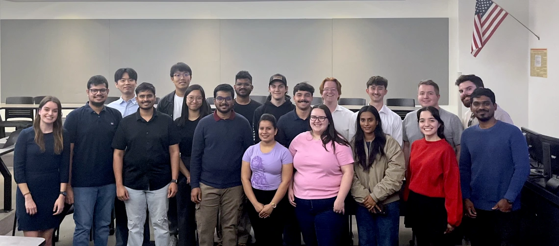 A group of students and their instructor in a classroom