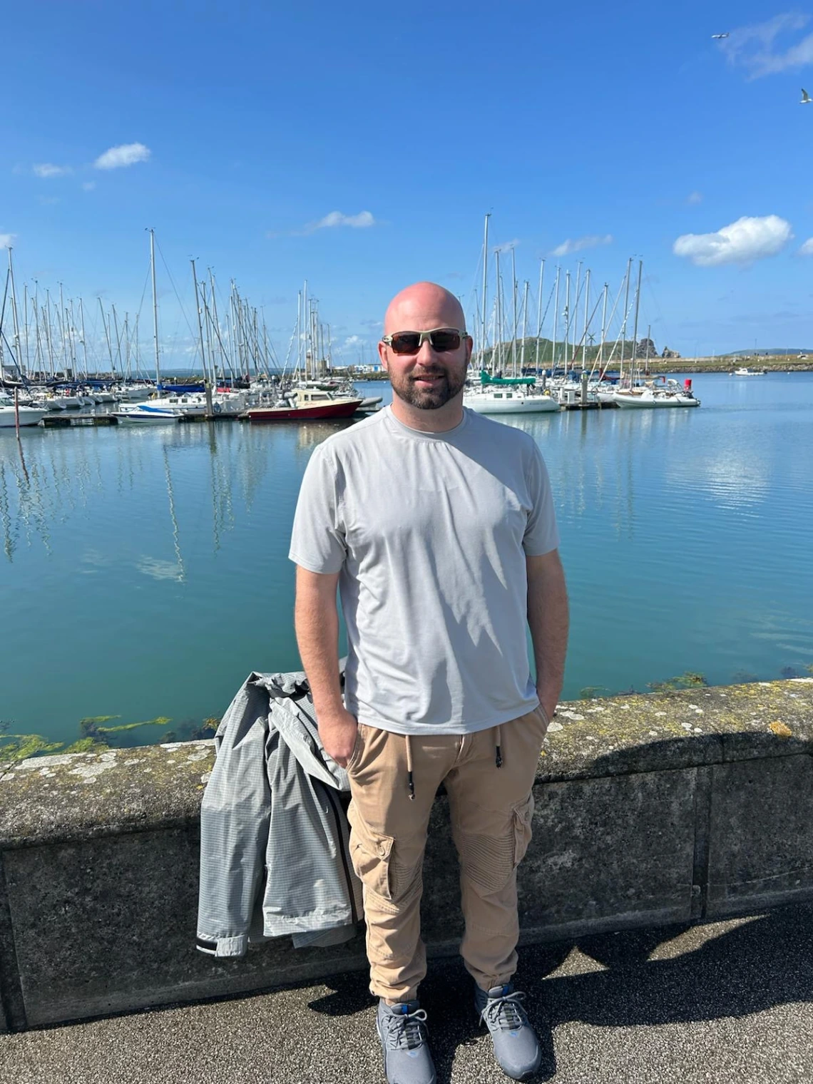 man standing in front of body of water