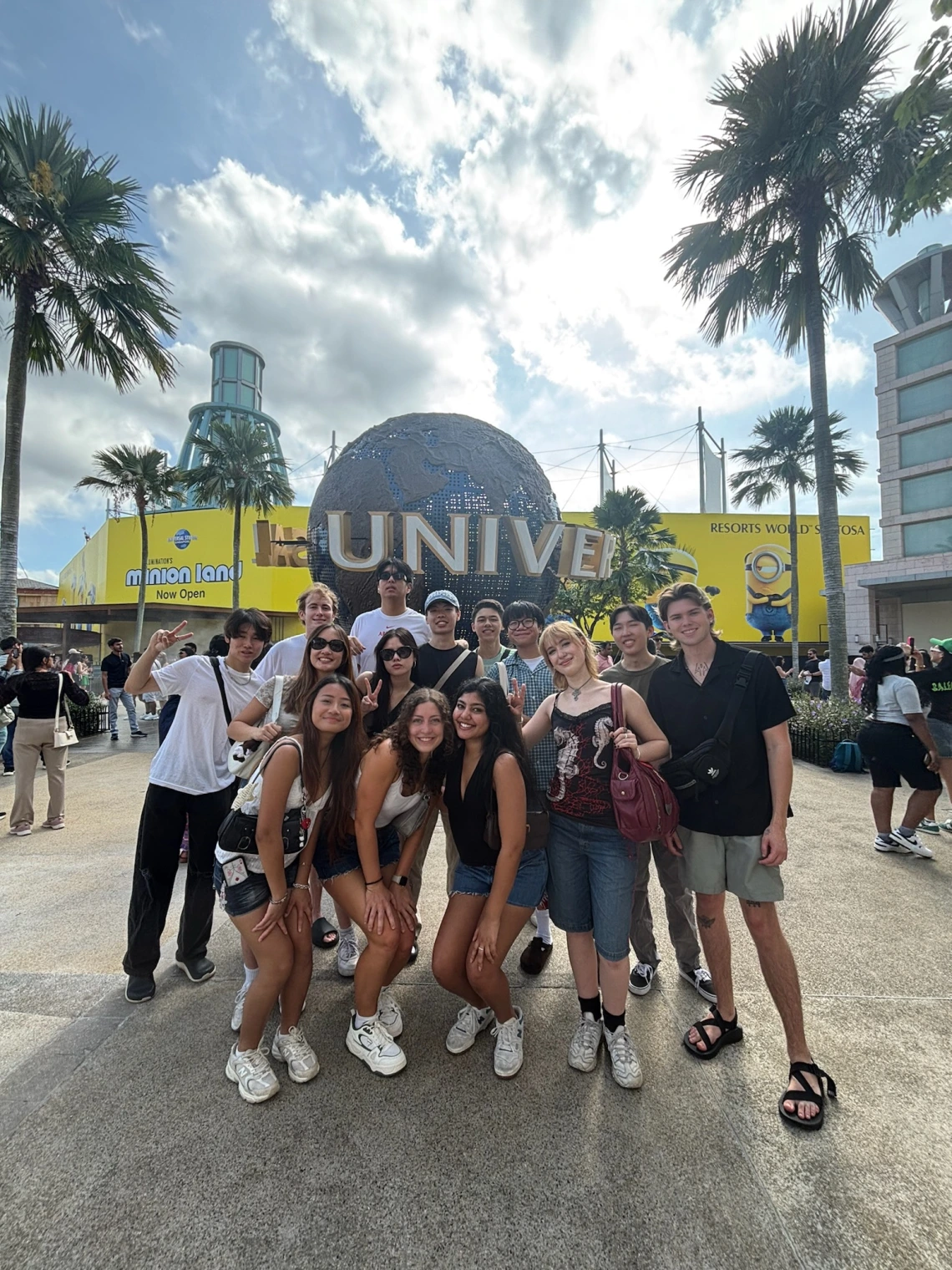 people standing in front of universal studios