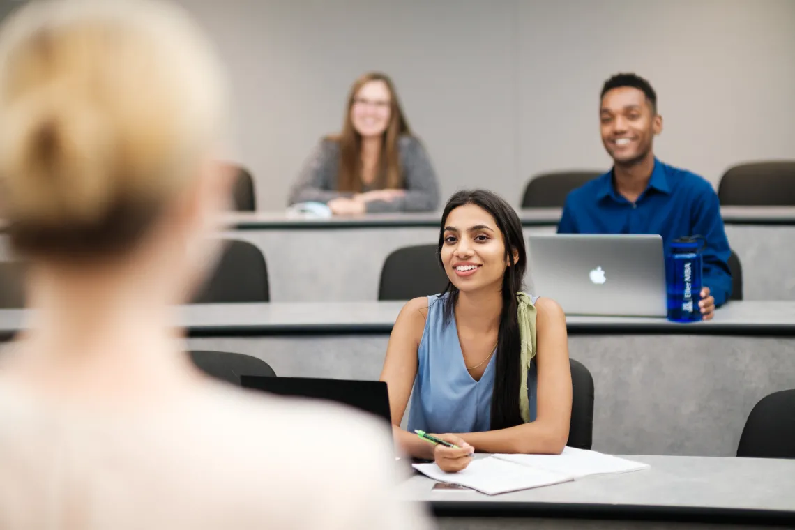 full time students in classroom looking at professor