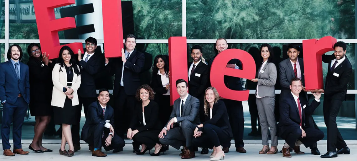 Eller MBA students with ELLER letters