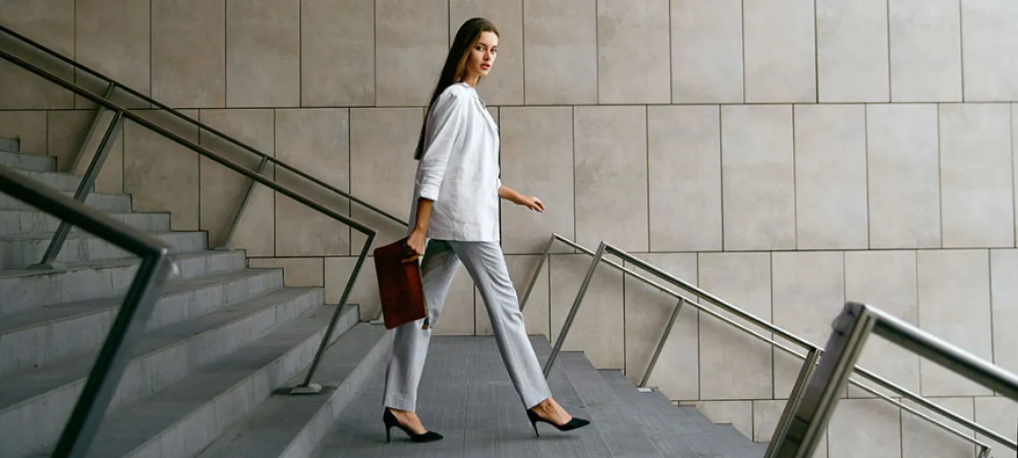 Professional woman walking down stairs