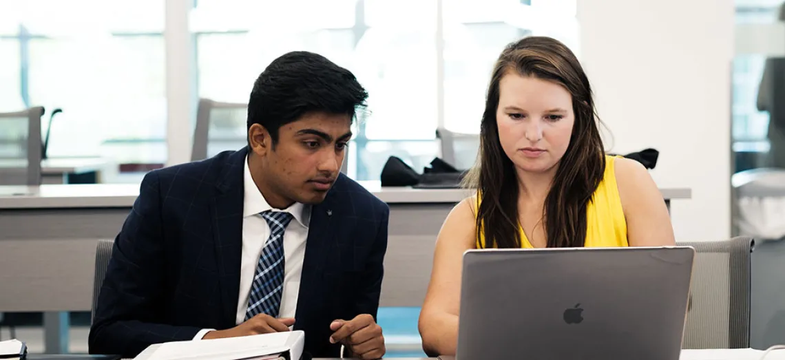 Eller students with laptop