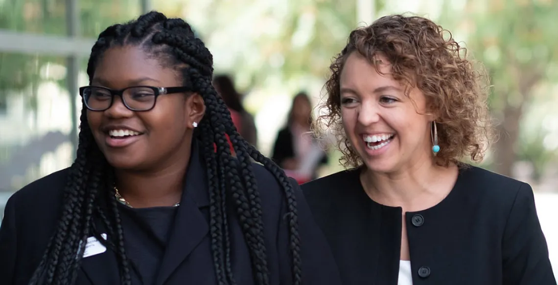 Smiling female MBA students