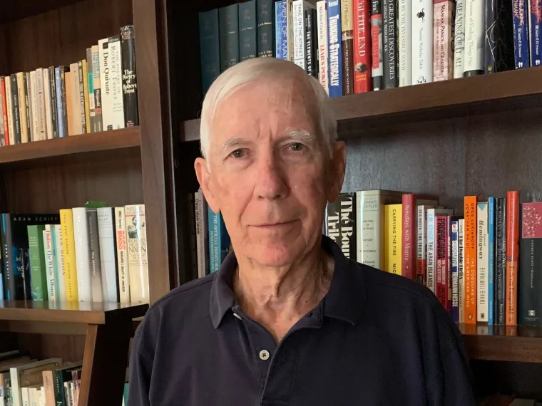 mark walker headshot in a library