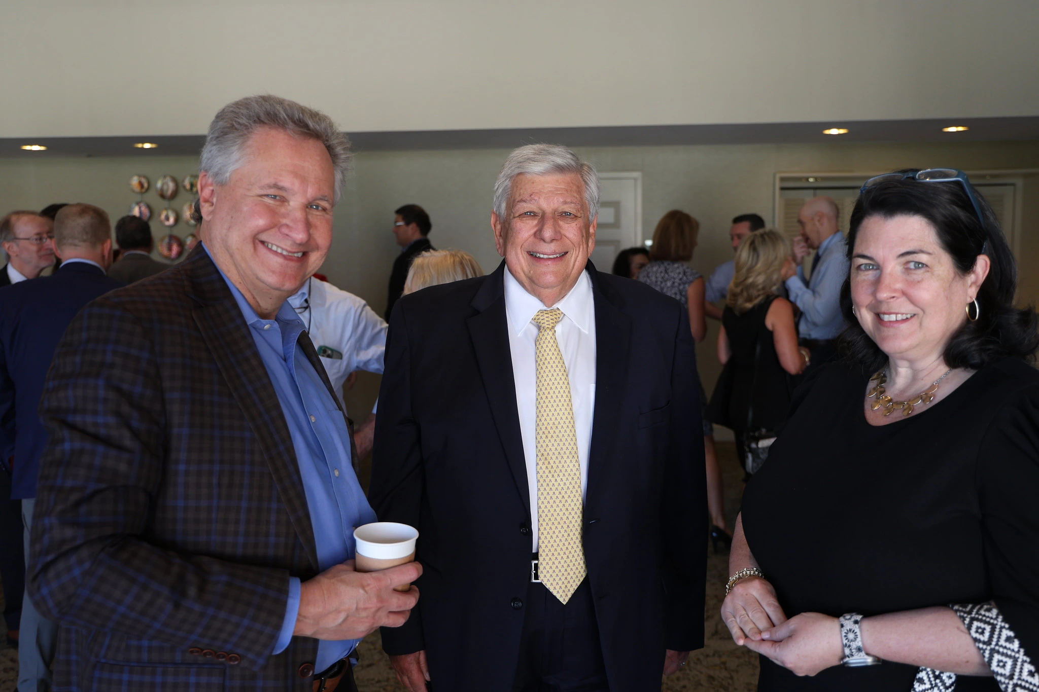 three people smiling