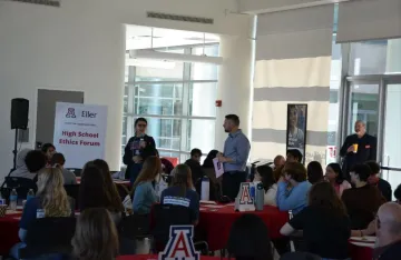 High School event with student speaking to crowd