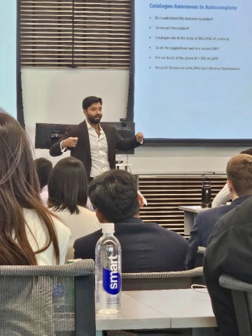 Alumnus speaking to students in a classroom