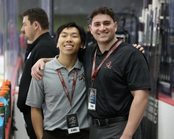 Elliot smiling posing with colleague from AZ Roadrunners