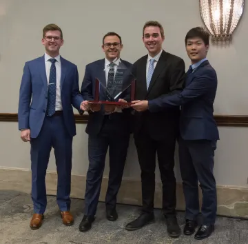 Finance students Payton Rudnick, Steven Feeney, Nick Stankoven and Jingsong Wu with their first place award