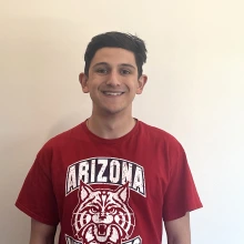 Student smiling wearing a University of Arizona T-shirt