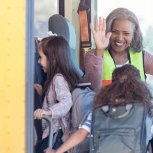 children going onto school bus