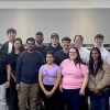 A group of students and their instructor in a classroom