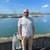 man standing in front of body of water