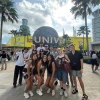 people standing in front of universal studios