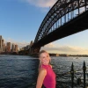 Payton standing in front of a scenic bridge