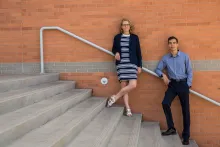 Two students standing on steps outside Eller