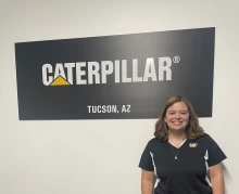 girl in front of logo